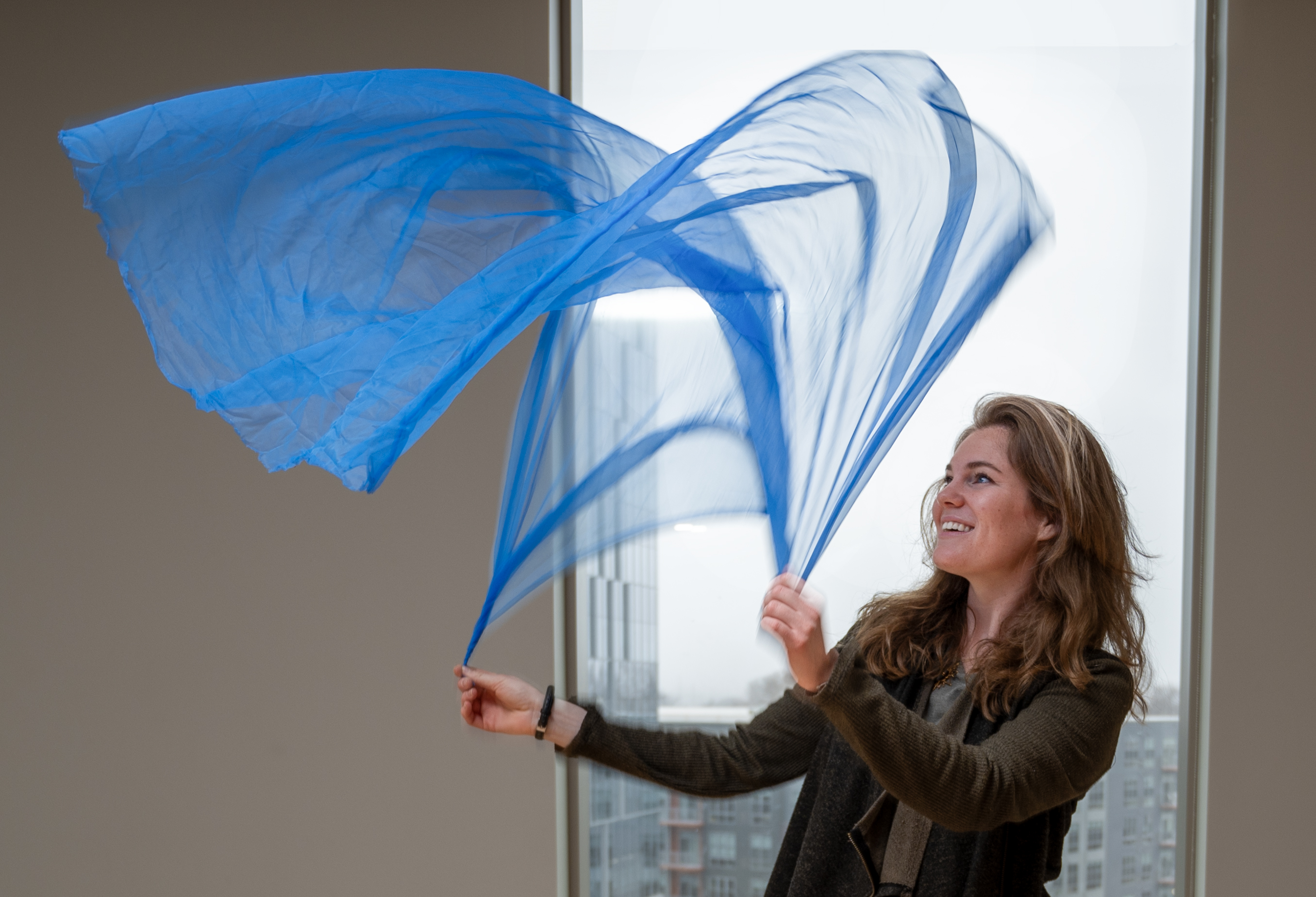 Genevieve Hargrove dancing with a blue scarf